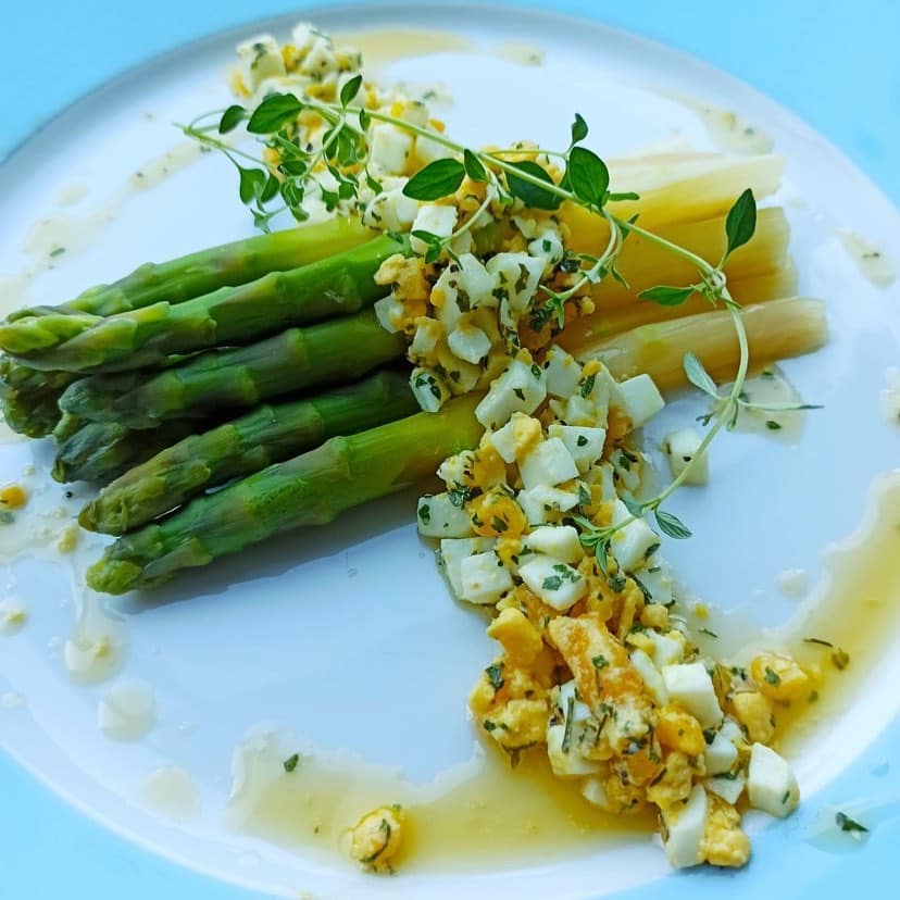 Asparagus with egg salad and herbs